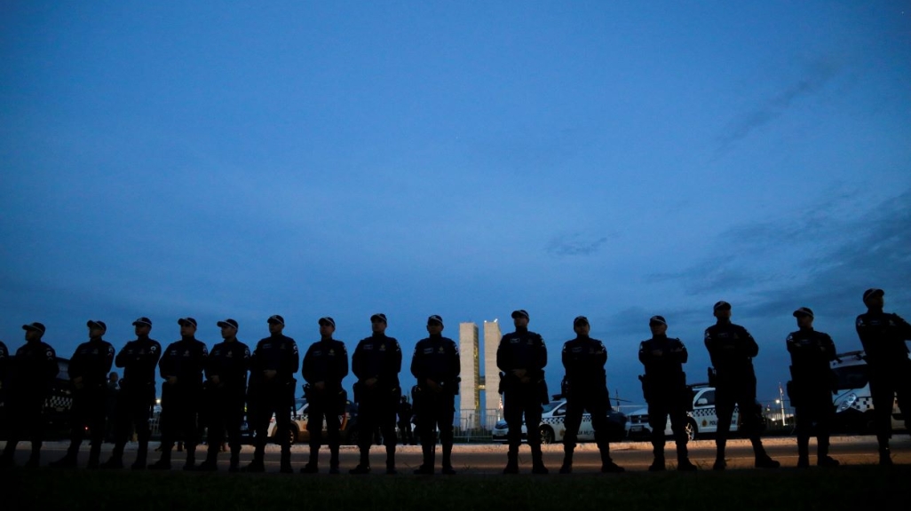 Military police stand in front of the National Congress building. (AP)