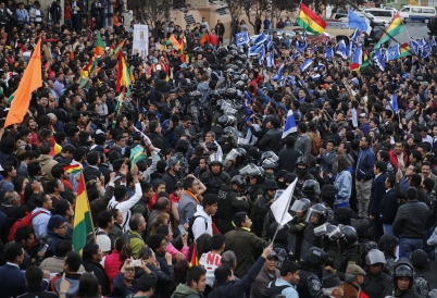 Police separate supporters of opposing candidates in La Paz. (AP)