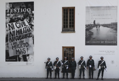 Colombian soldiers stand by a poster promoting peace. (Image: AP)