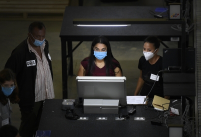 Venezuelan election workers test new voting machines. (AP)