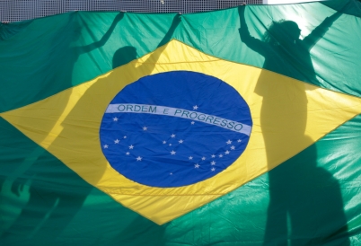 Brazilian flag held up by protesters.