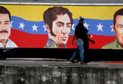 A Mural in Caracas Venezuela Featuring Maduro, Bolivar, and Chávez