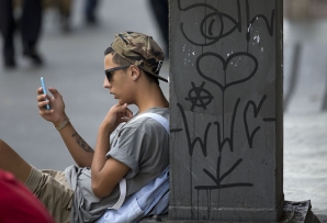 A man checks his smartphone in São Paulo. (AP)