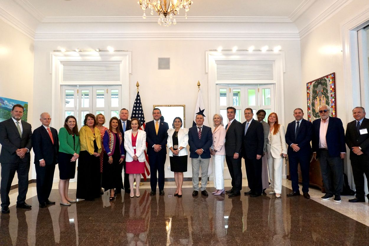 Multiple people posing for the picture