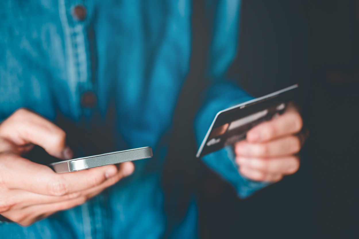A smartphone user making a payment