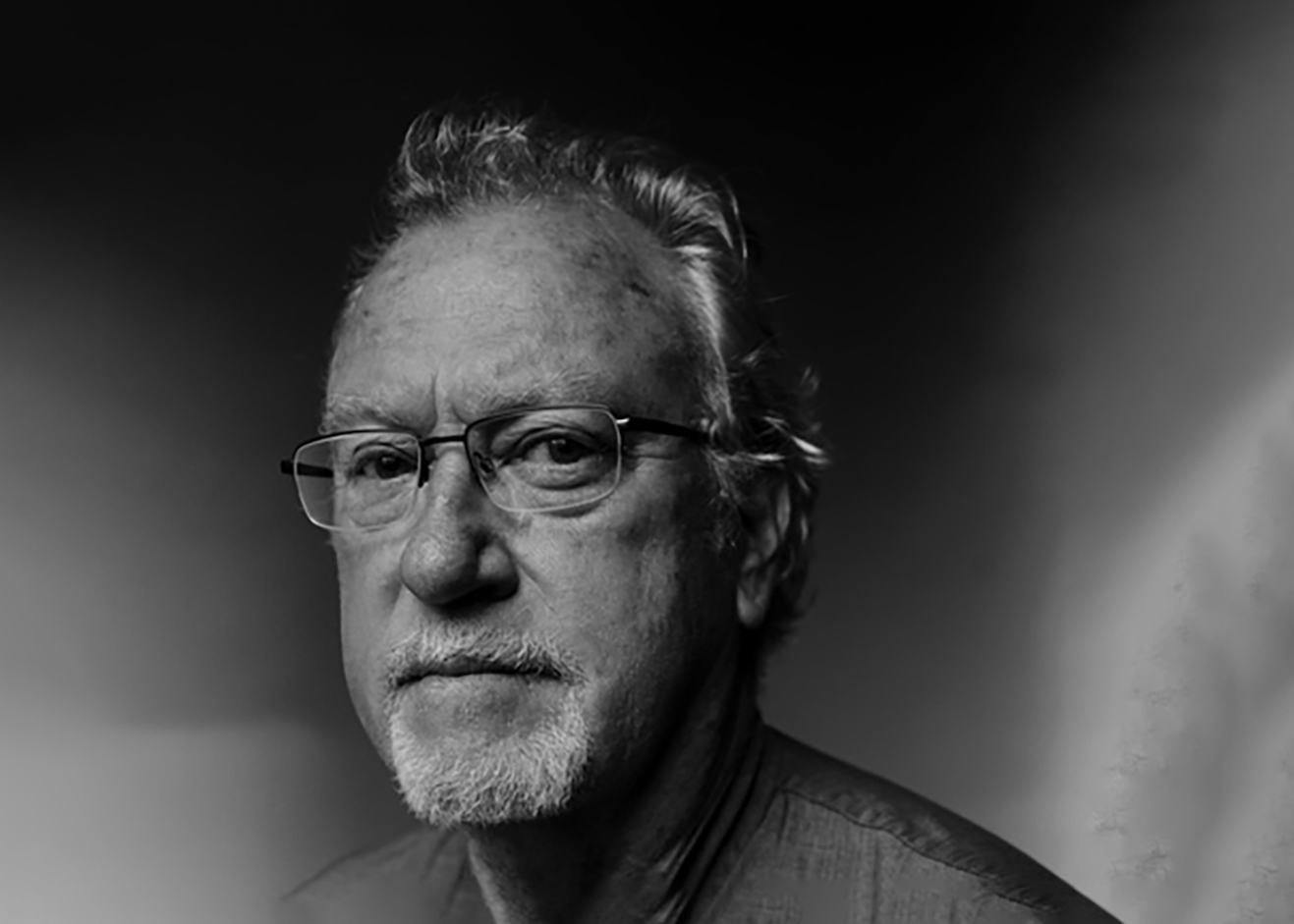 A black and white photo of Jon Lee Anderson.