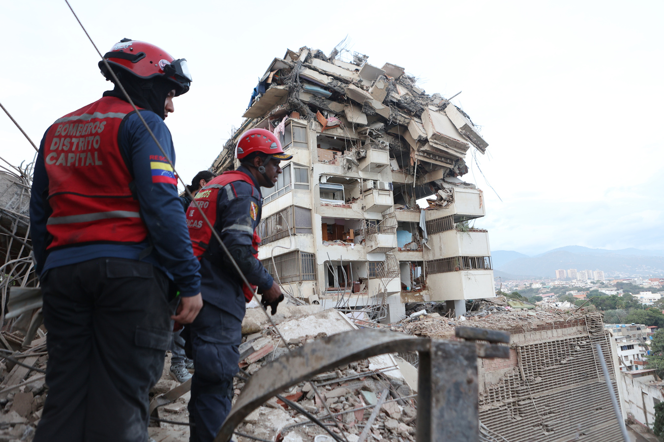 Rescue workers in Caracas. (AP)