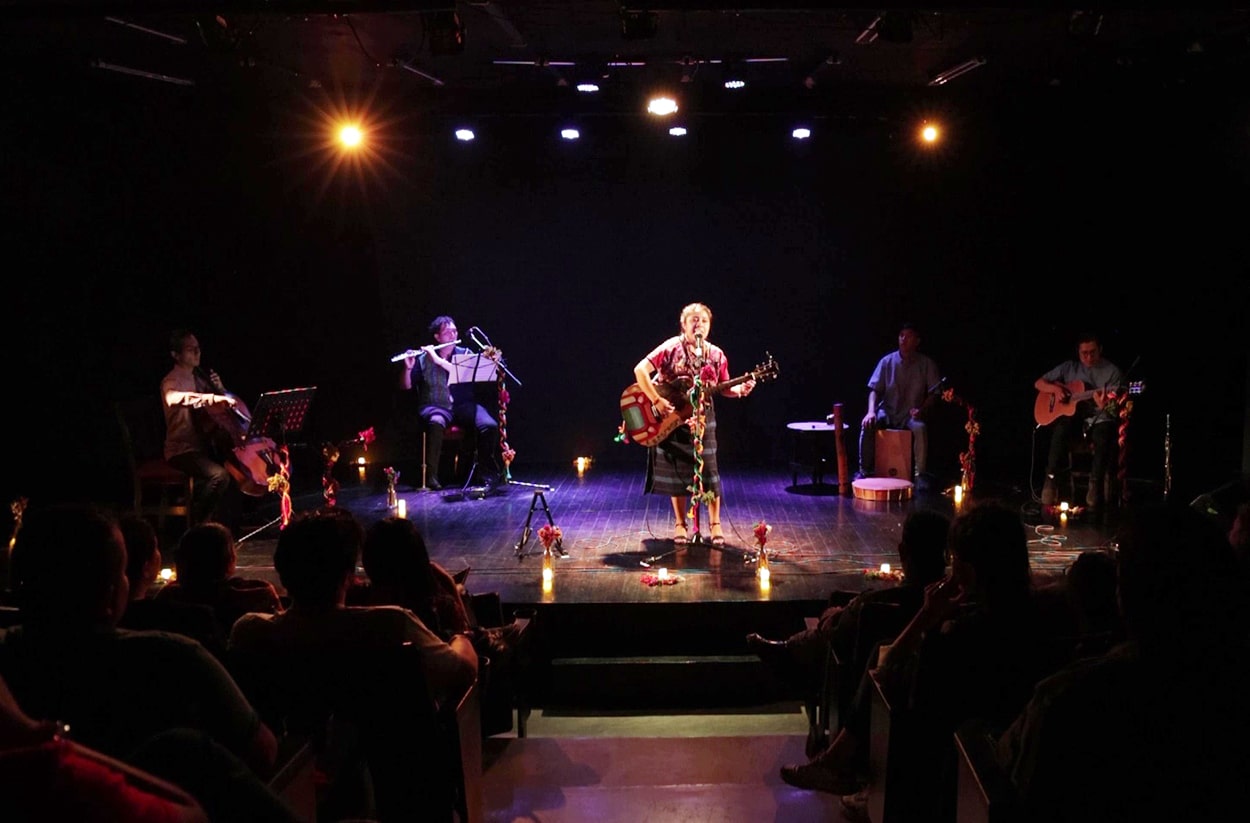 Ch'umilkaj and her band