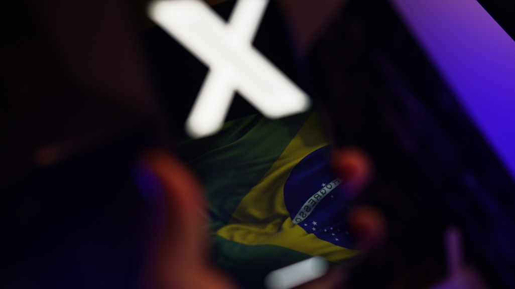 Brazilian flag reflected on a phone screen