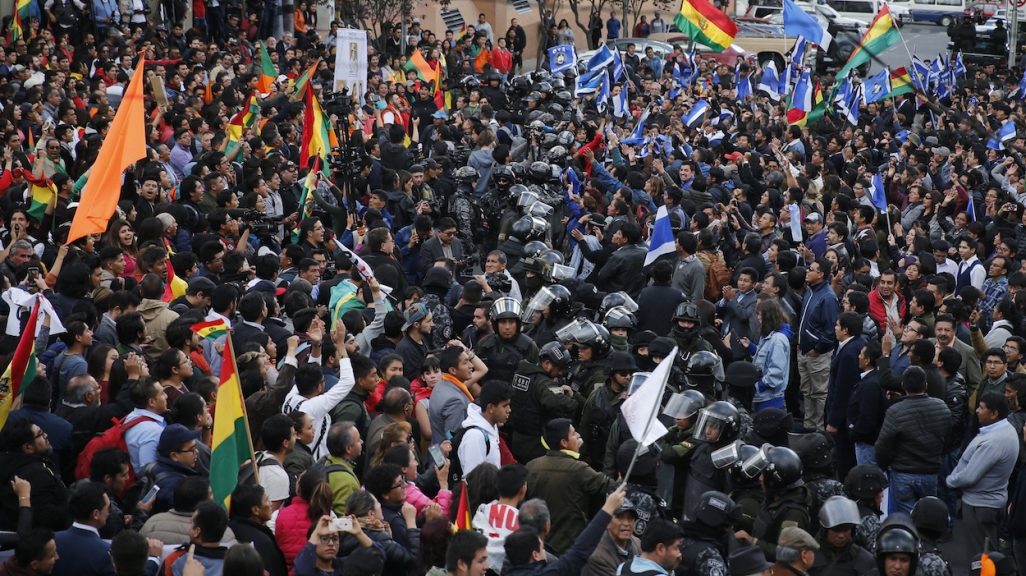 Police separate supporters of opposing candidates in La Paz. (AP)