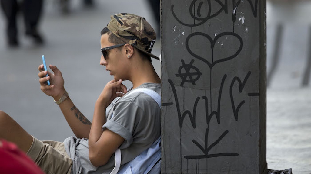A man checks his smartphone in São Paulo. (AP)