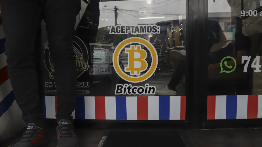 A merchant accepts Bitcoin in El Salvador. (AP)