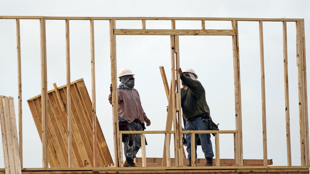 Construction workers build a new home in Houston. (AP)