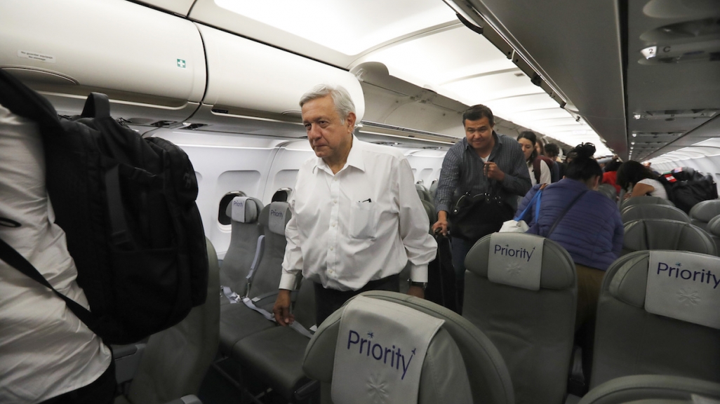 President AMLO on a commercial flight. (AP)