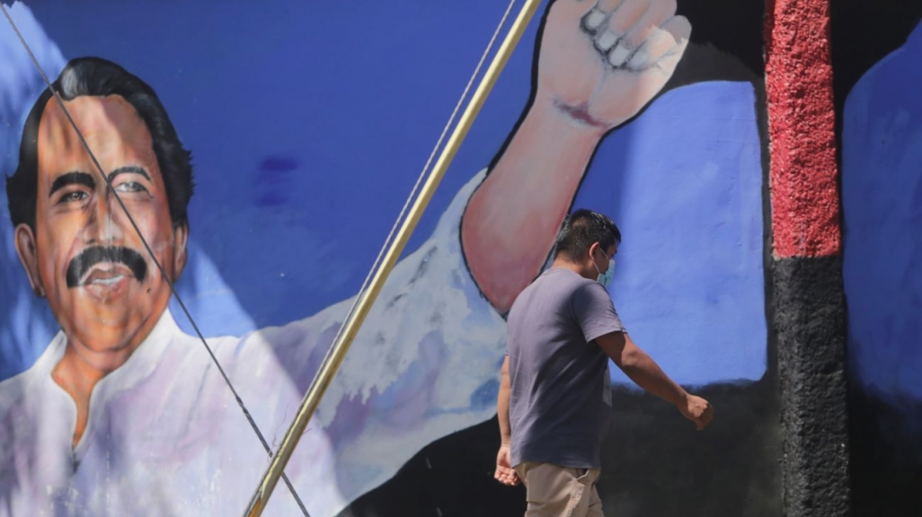 A man walks past a mural of Nicaragua's Daniel Ortega. (AP)