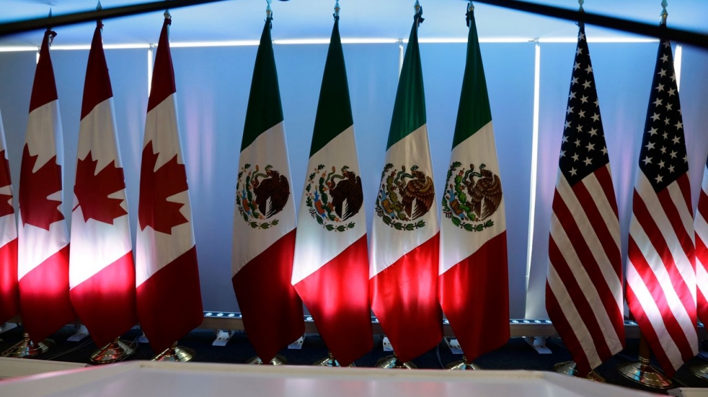 North American flags. (AP)