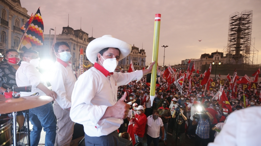 Peruvian presidential candidate Pedro Castillo holds his iconic pencil prop at a rally. (AP)