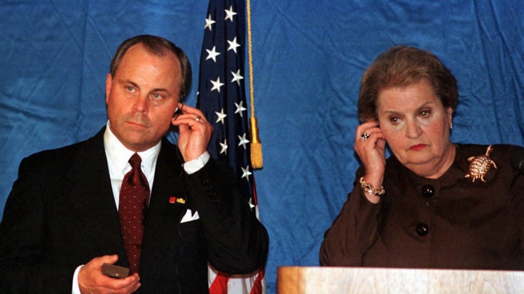 Mack McLarty and Madeleine Albright listen during a press conference in Caracas in 1998. (AP)