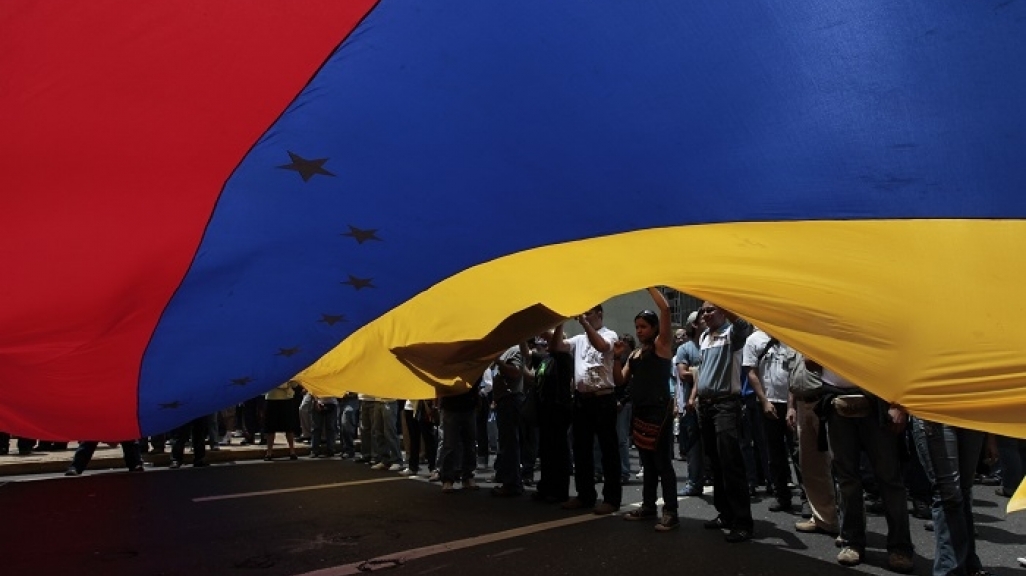 Venezuelan demonstrators with flag (AP)