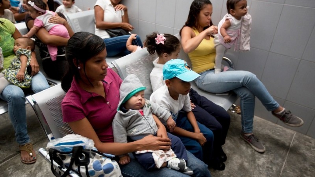 Venezuelan women in a waiting room with chidlren. (Associated Press)
