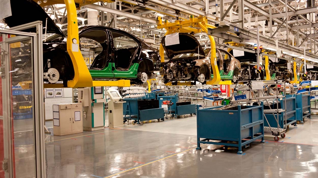 An automobile assembly line. (AdobeStock)