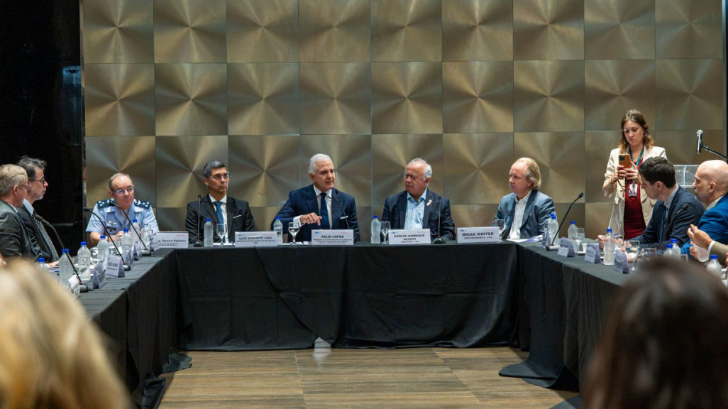 Multiple people seating at a table during the event