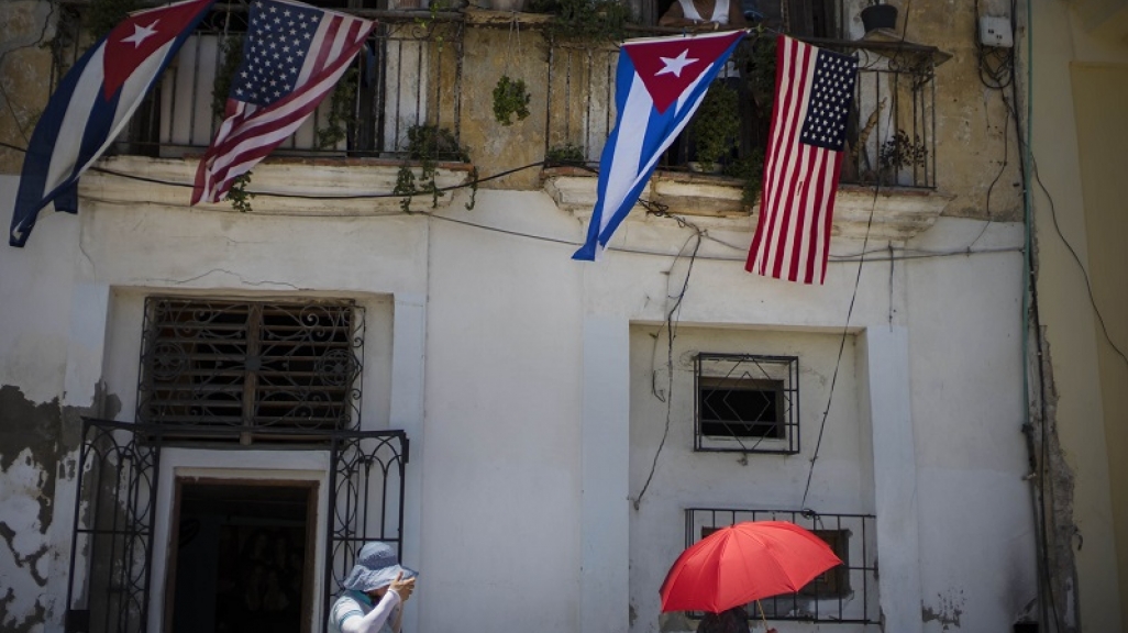The US and Cuban flags over a balcony in Havana, Cuba