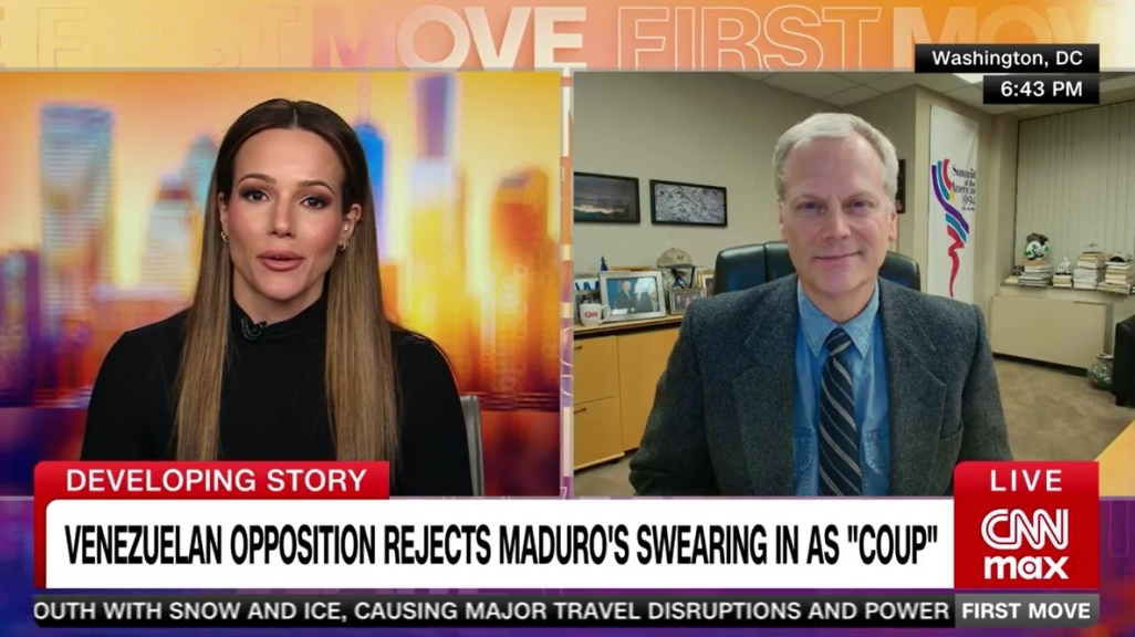 Eric Farnsworth on CNN with Isabel Rosales on screen