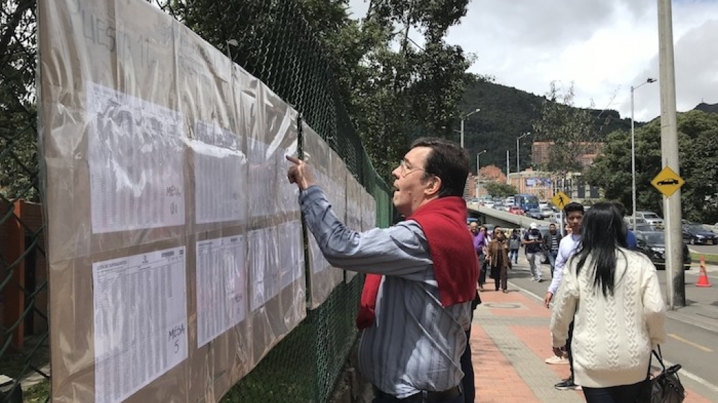 A Colombian voter checks the rolls in the Usaquén neighborhood of Bogotá on June 17.