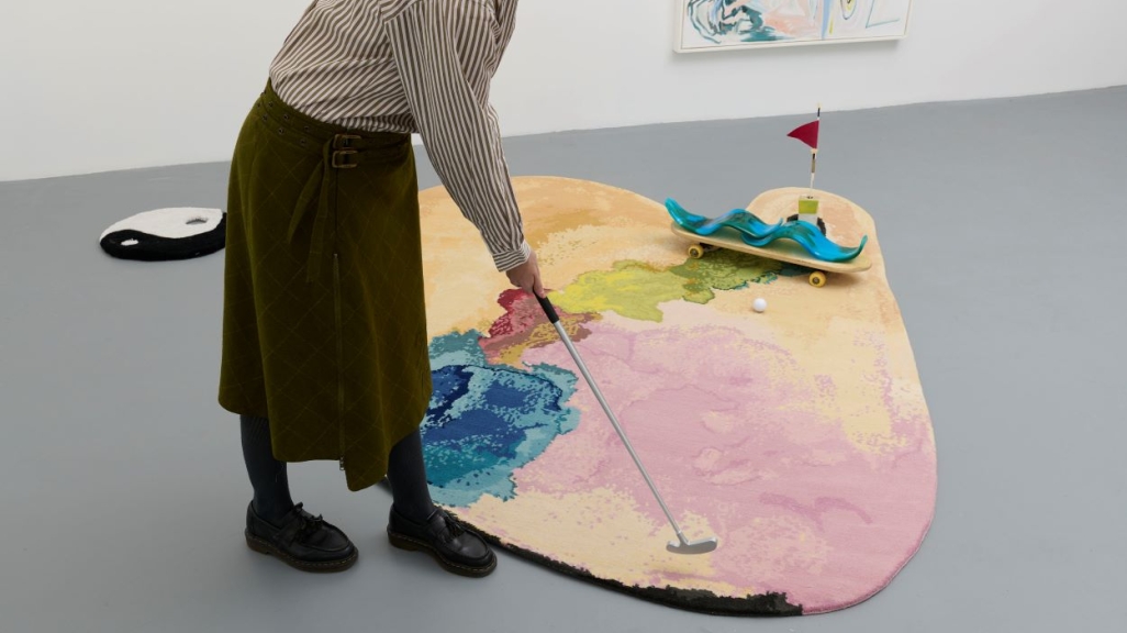 Picture of a mini golf installation and a woman playing 
