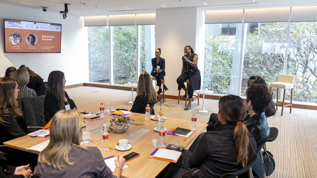 Rachel Maia and Flavia Lima speak with participants of Women's Hemispheric Network in São Paulo.