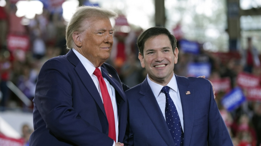 Donald Trump and Marco Rubio stand side by side, smiling.