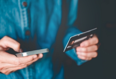 A smartphone user making a payment