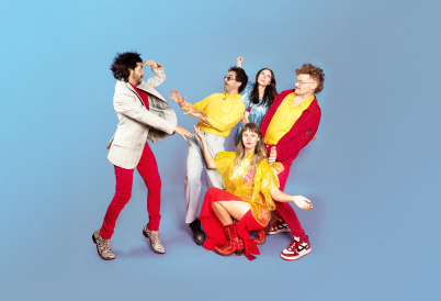 Five people in red, yellow, beige, and blue clothing pose in exaggerated comical stances against a blue background.