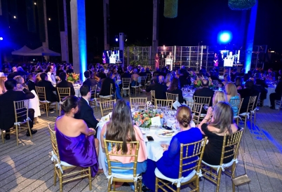 People seating around dining tables during the ceremony
