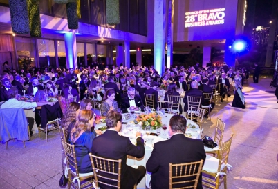 People seating around dining tables during the ceremony