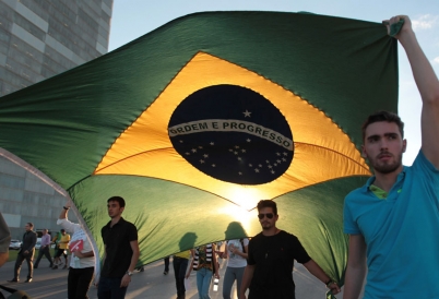 Anti-government protestors parade Brazilian flag