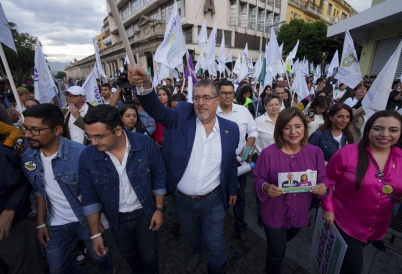 Bernardo Arévalo, center, exceeded expectations to make it to the runoff. (AP)