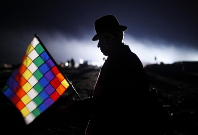 An Aymaran man holds the Wiphala flag. (AP)