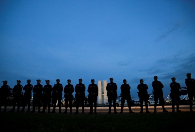 Military police stand in front of the National Congress building. (AP)
