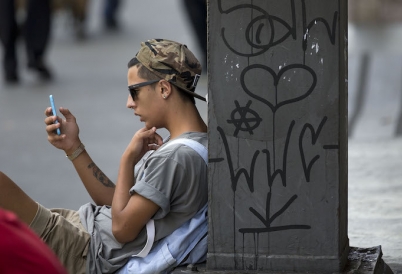 A man checks his smartphone in São Paulo. (AP)