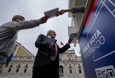 Chileans receive copies of the new draft Constitution. (AP)