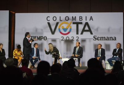 Gustavo Petro, standing, speaks at a debate in Bogotá. (AP)