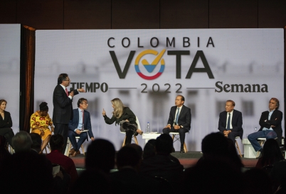 Gustavo Petro, standing, speaks at a debate in Bogotá. (AP)