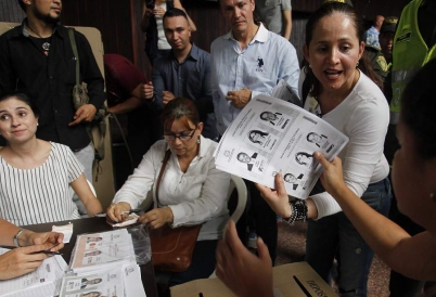 Colombian poll workers tally presidential primary ballots. (AP)