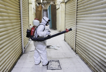 A worker disinfects a market in Mexico City. (AP)