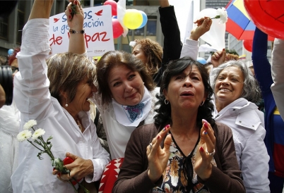 Women celebrating peace deal