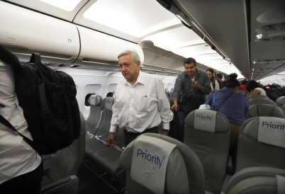 President AMLO on a commercial flight. (AP)
