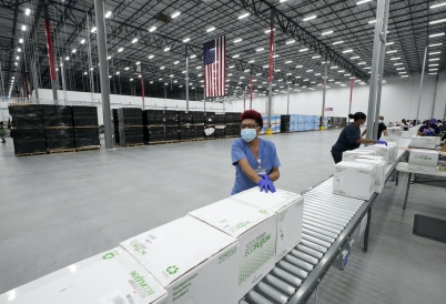 A Moderna employee in Mississippi readies vaccines for shipment. (AP)