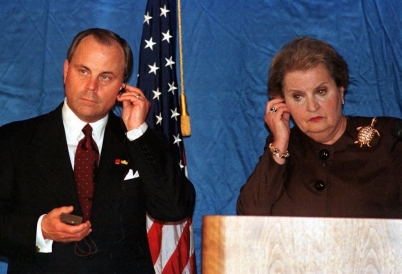 Mack McLarty and Madeleine Albright listen during a press conference in Caracas in 1998. (AP)